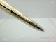 Santos de Cartier Pens - Yellow Gold Ballpoint Pen (5)_th.jpg